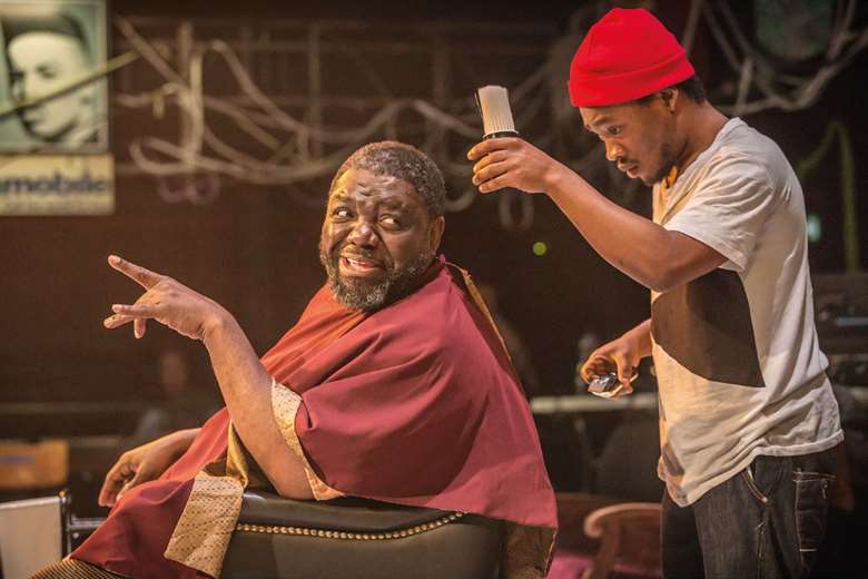  David Webber (Sizwe) and Fisayo Akinade (Samuel) in Barber Shop Chronicles at the National Theatre