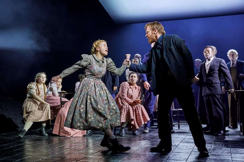 Milly Alcock as Abigail Williams, Brian Gleeson as John Proctor and the cast of The Crucible, West End 2023. 